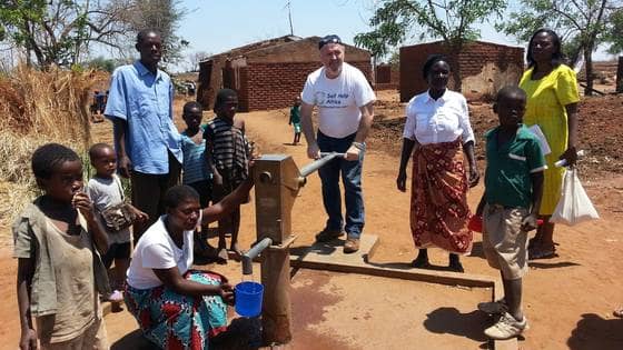 Ronan scully of gorta self help africa with beneficiaries in malawi  2 