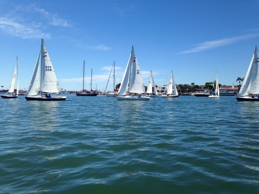 Newport Harbor Public Anchorage // sailing classes coming close to the anchored boats.