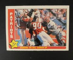 Patriots [Standing the Ball...] #51 Football Cards 1985 Fleer Team Action Prices