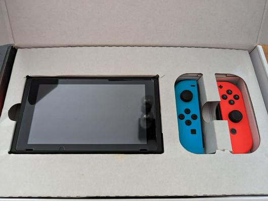 Nintendo Switch with Blue and Red Joy-con photo