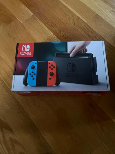 Nintendo Switch with Blue and Red Joy-con photo