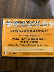 14/25 | Aaron Nola [Red] Baseball Cards 2023 Topps Series 1 1988 35th Anniversary Relics